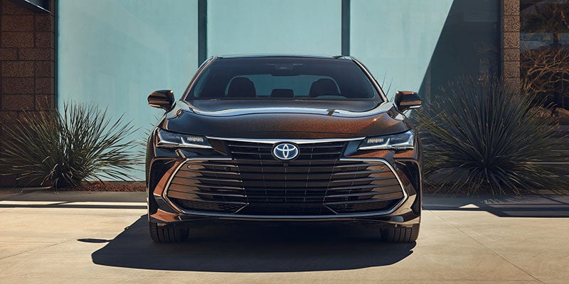 front view of a 2021 Toyota Avalon Hybrid parked in a driveway