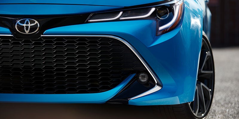 Closeup of the grill and headlamps of a Toyota Corolla Hatchback