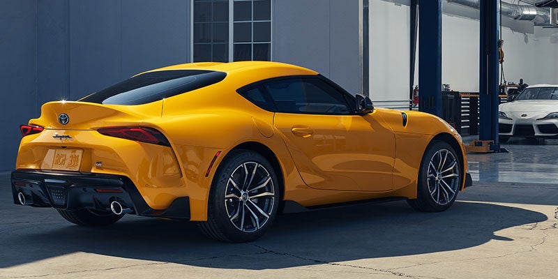 Side view of a yellow 2021 Toyota GR Supra